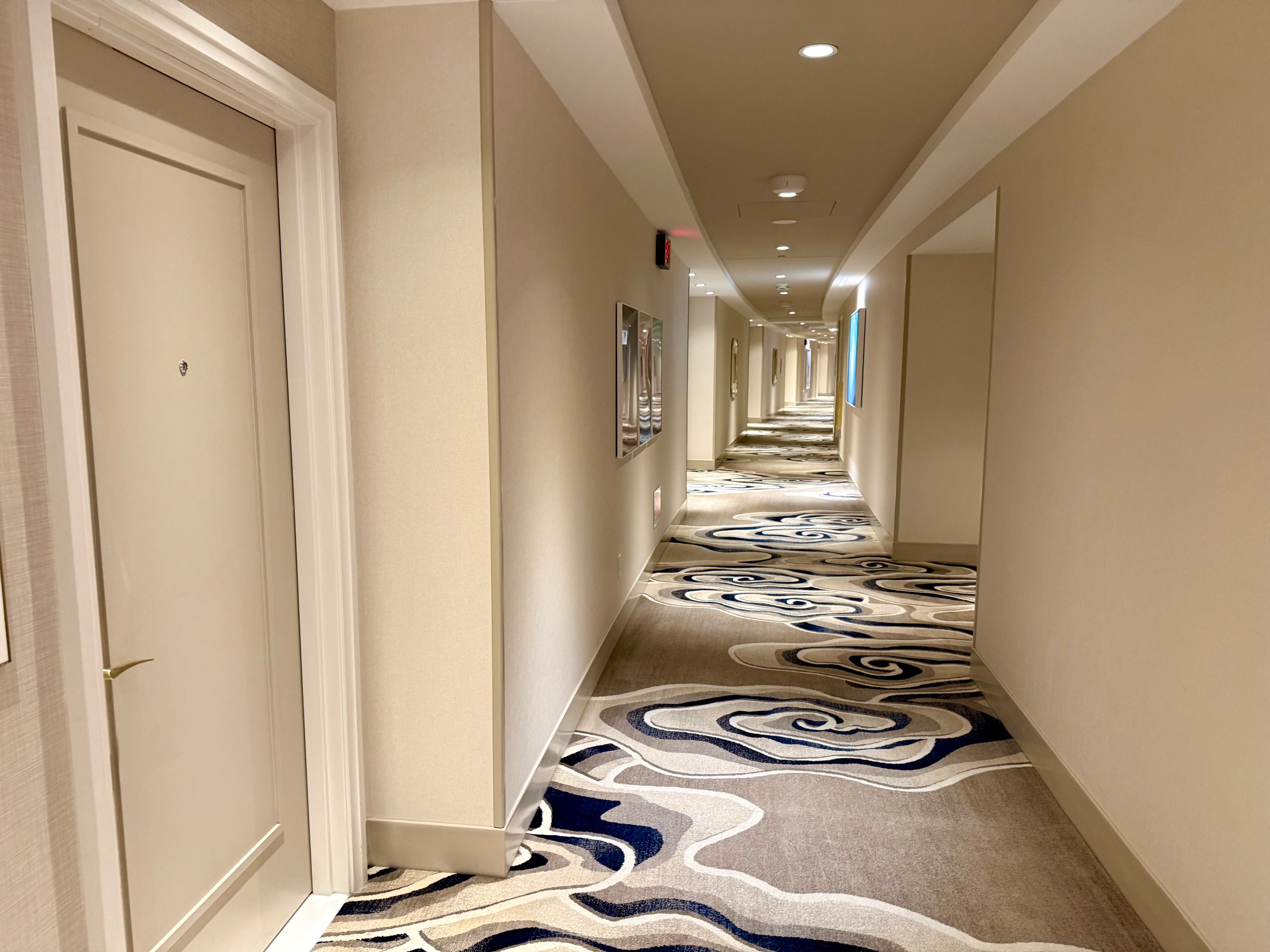 a hallway with a carpeted floor
