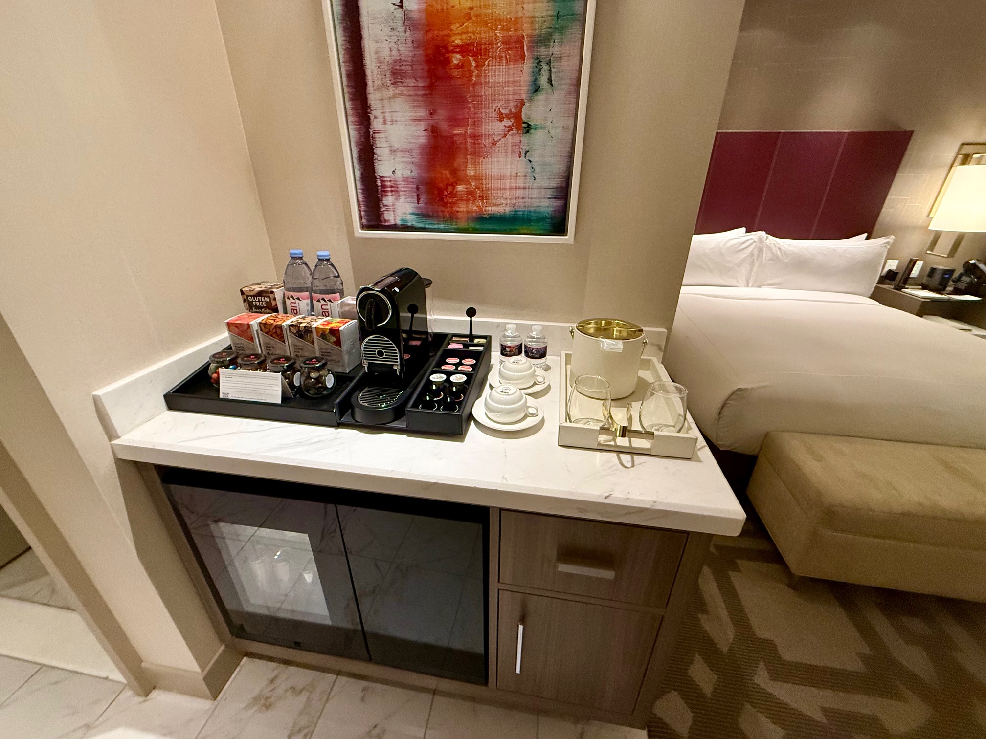 a coffee machine and tea set on a counter in a hotel room