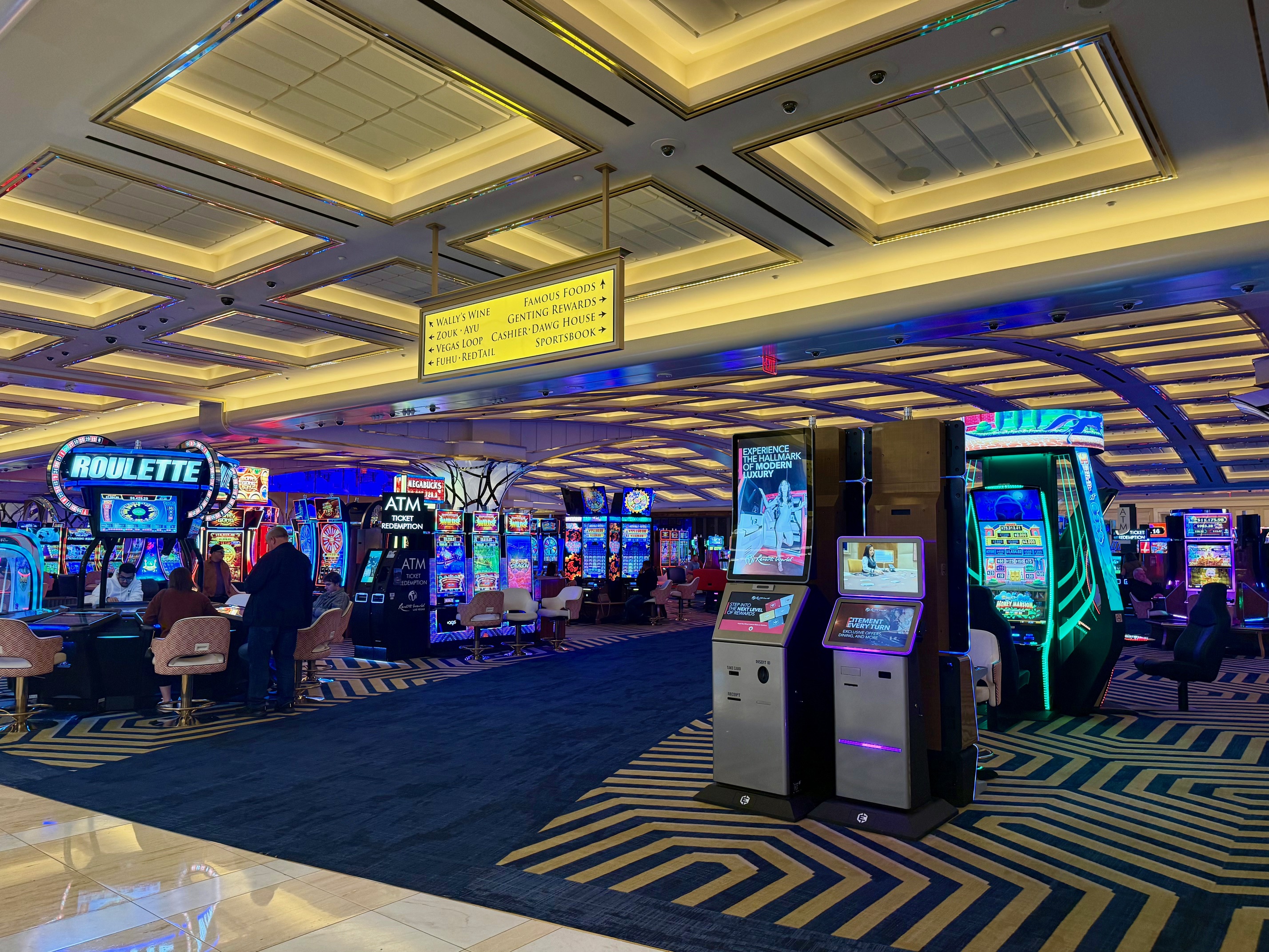 a room with a casino and slot machines