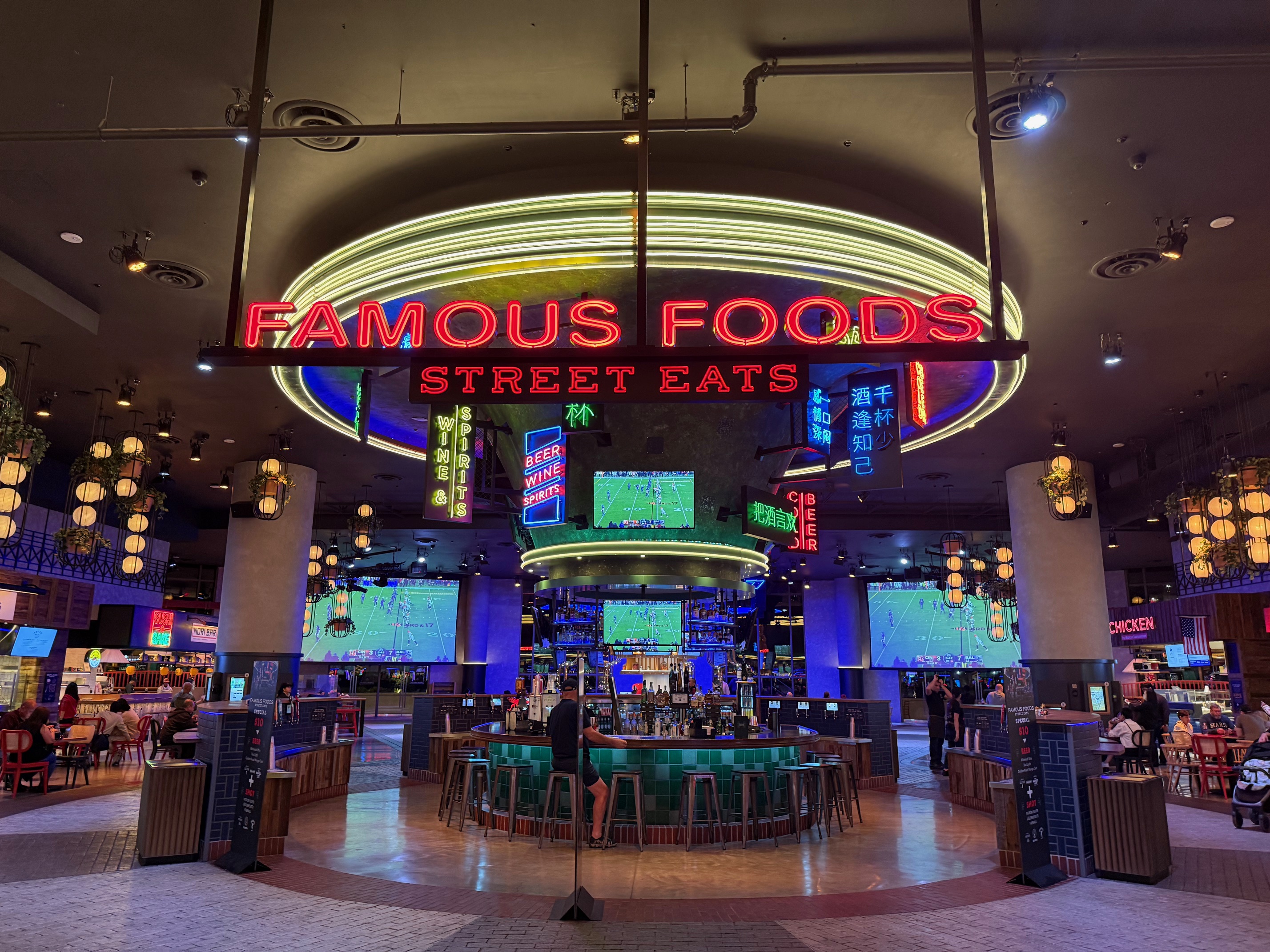 a restaurant with a large round table and chairs