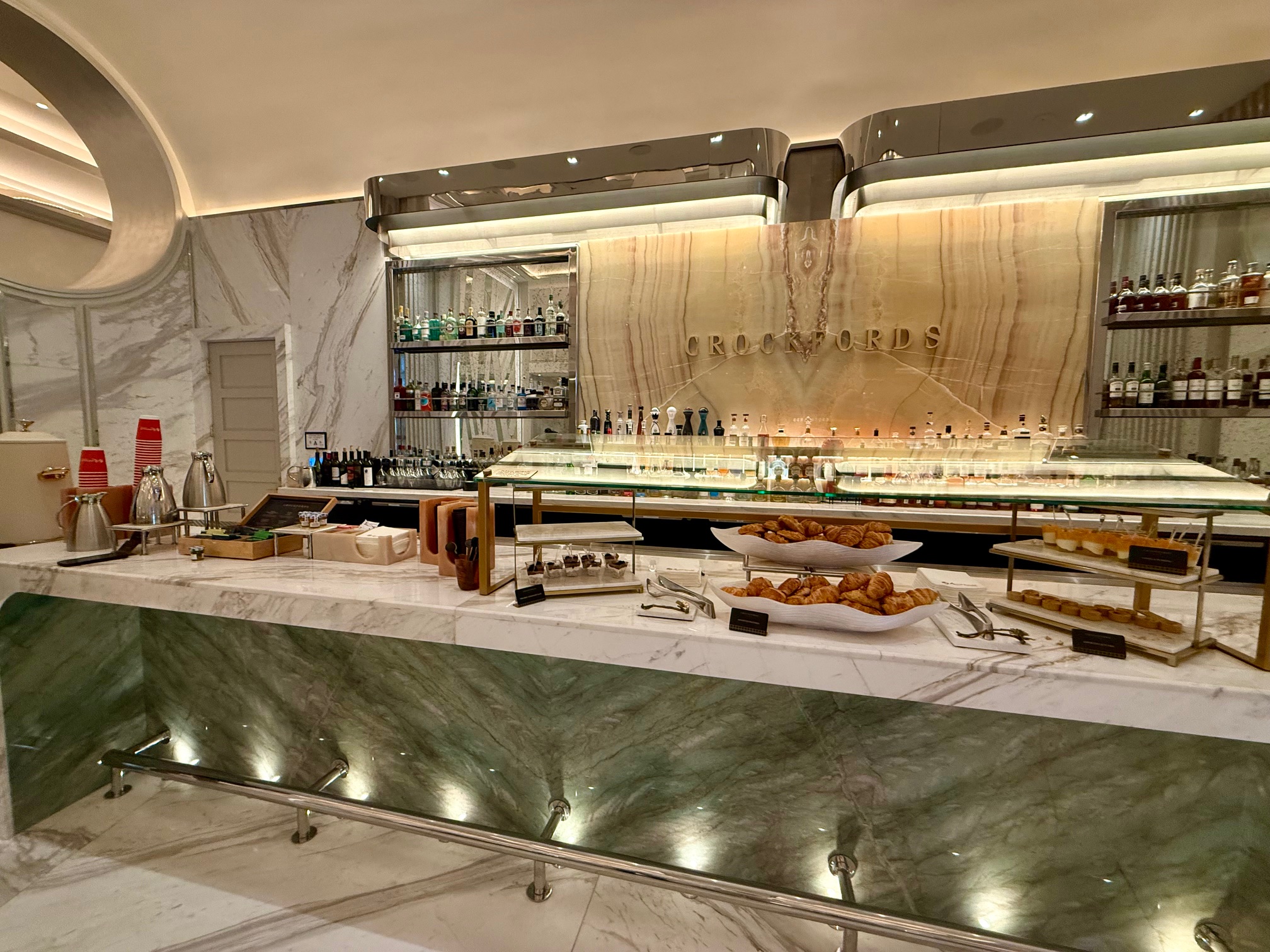 a buffet with food on it at the Crockfords Las Vegas