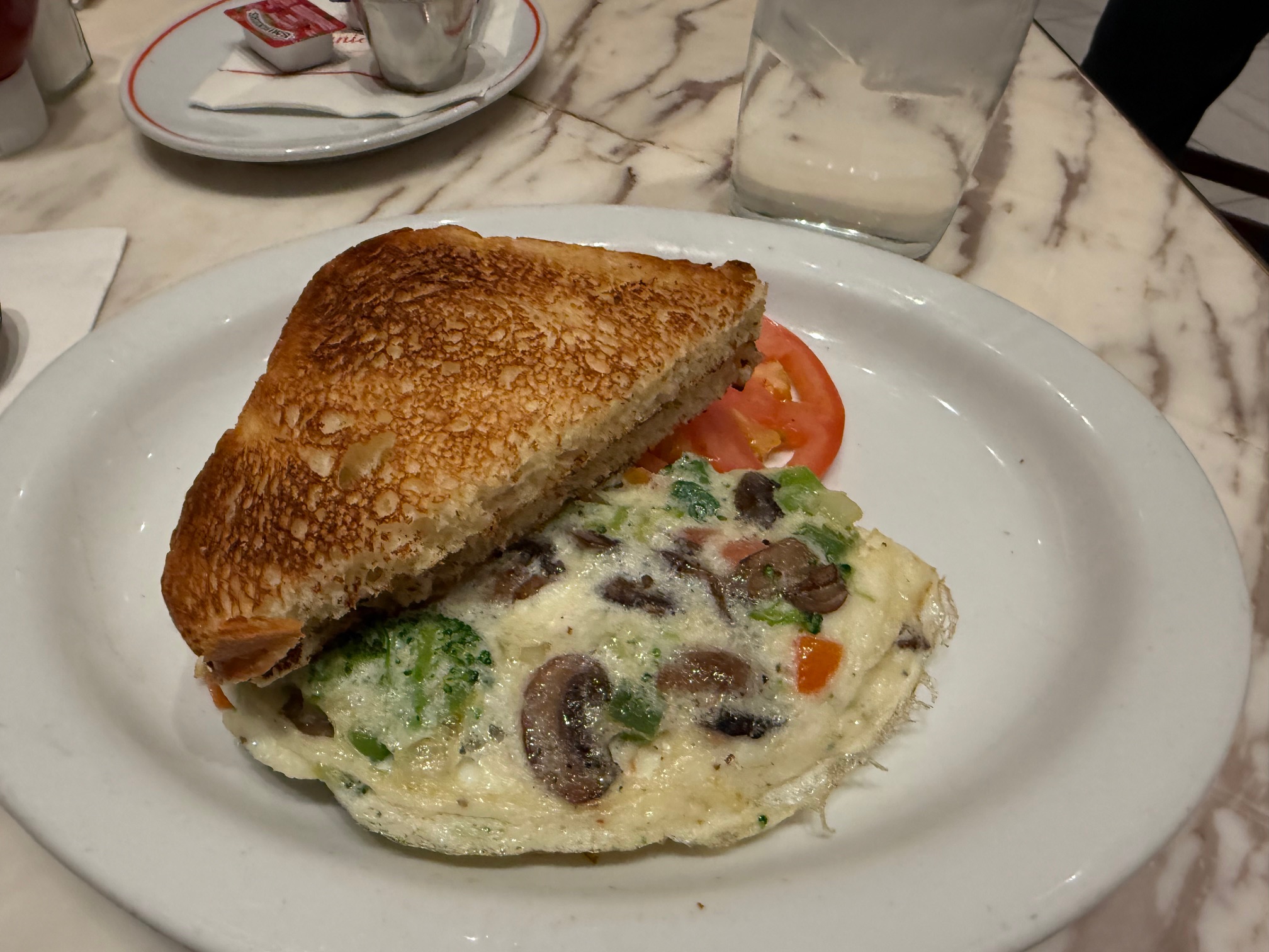 a sandwich and egg on a plate