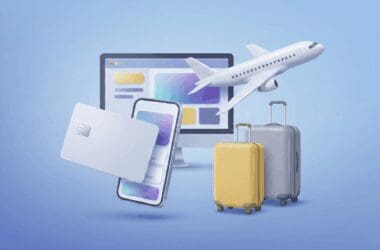 A 3D graphic with a credit card, mobile phone, computer screen, two suitcases, and an airplane on a blue gradient background