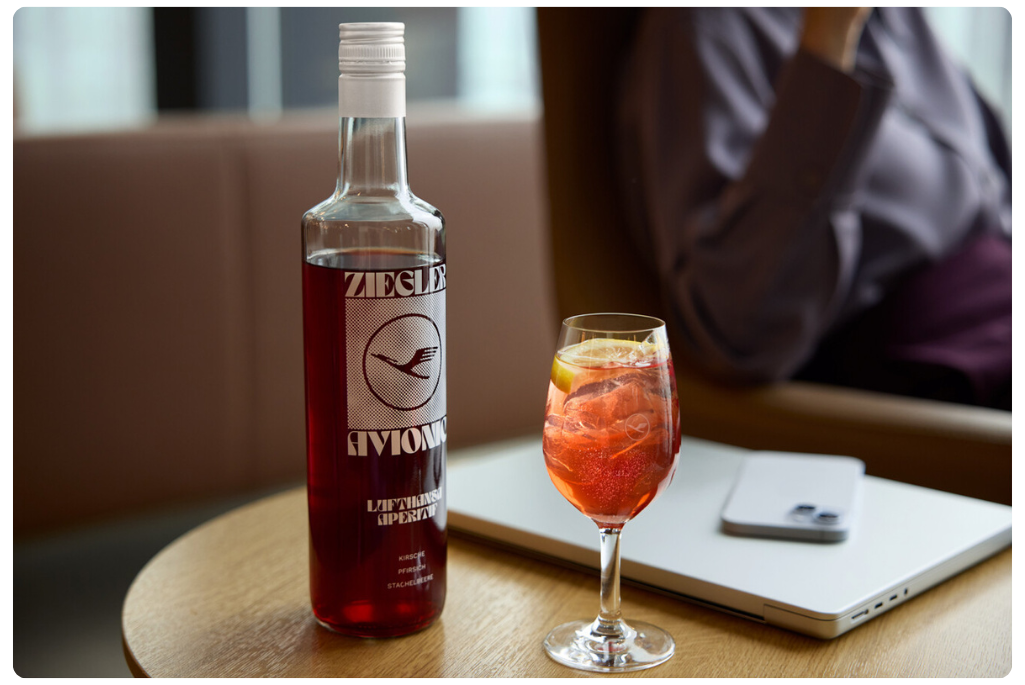 A bottle of Lufthansa Avionic next to a glass of the apertif-style drink