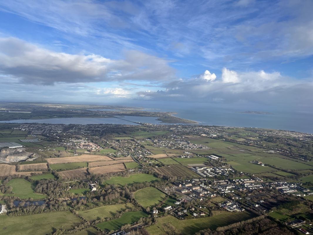 an aerial view of a city and water