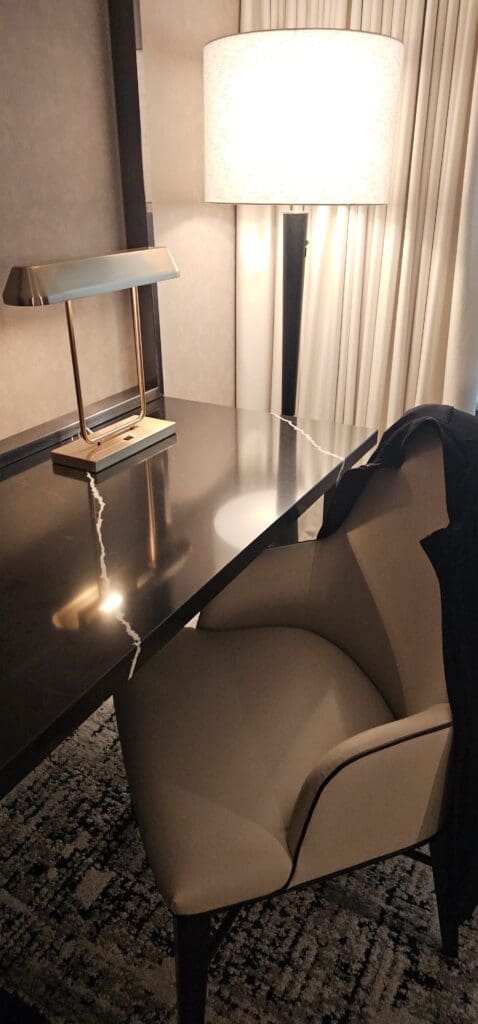 a desk with a lamp on it
