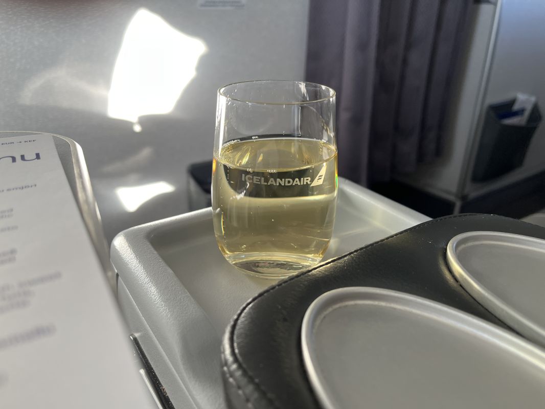 a glass of liquid on a tray