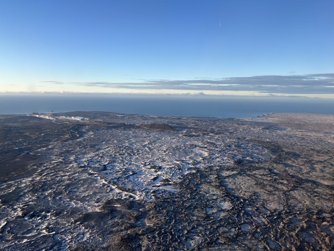 a landscape with snow and water