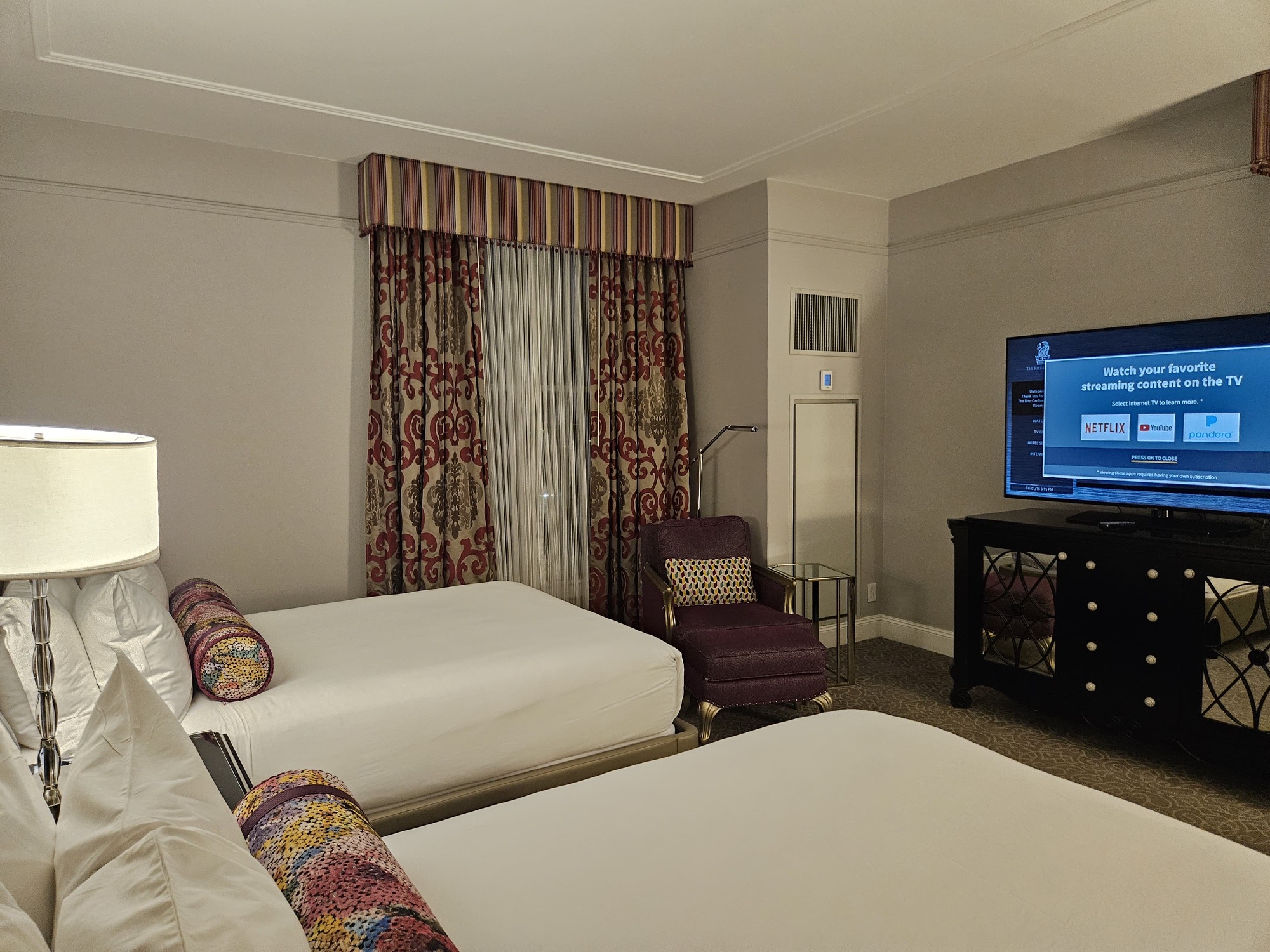 a room with two beds and a television at the Ritz Carlton New Orleans