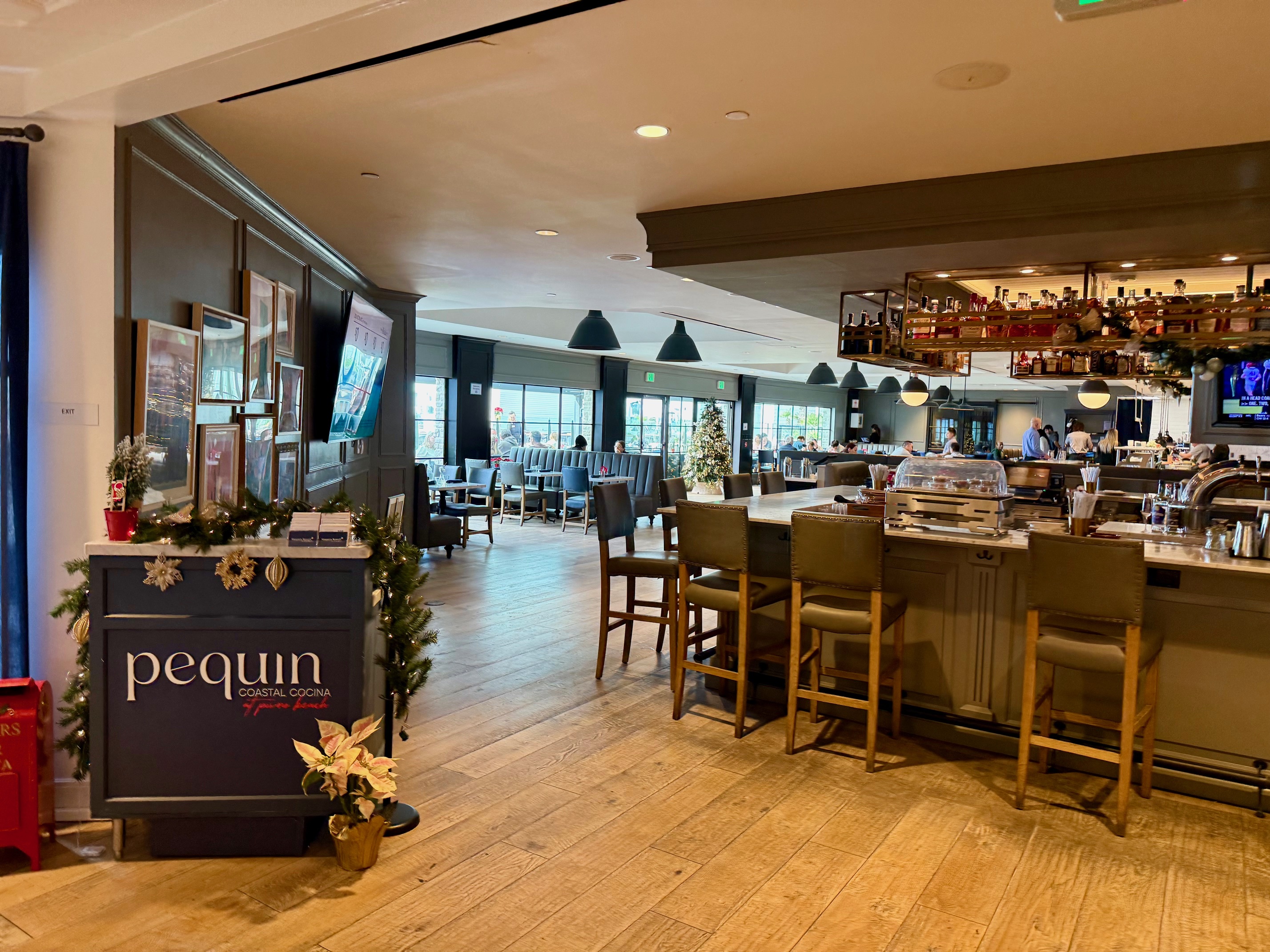 a restaurant with tables and chairs at Vespera Resort Pismo Beach
