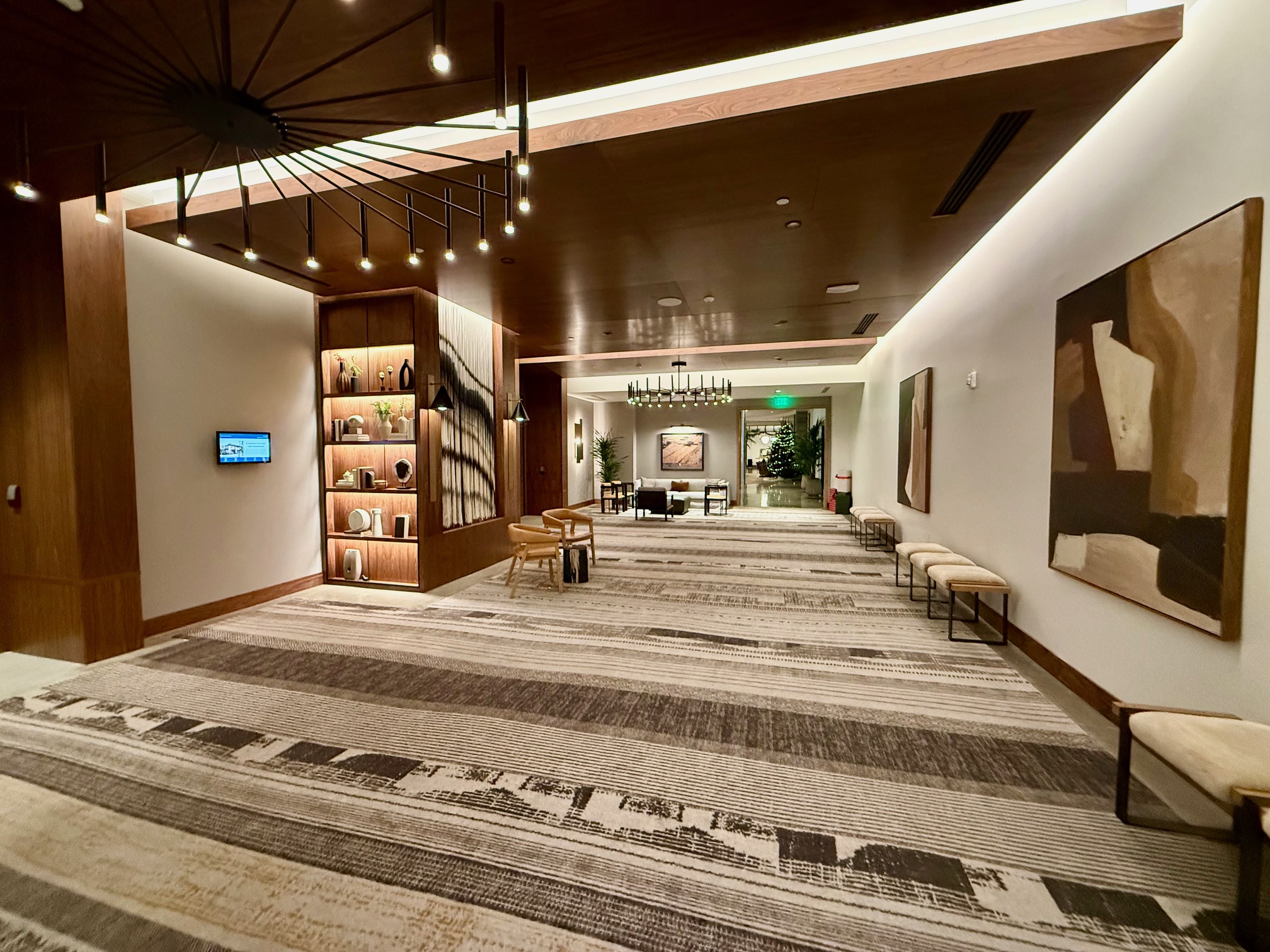 a hallway with a large carpeted area