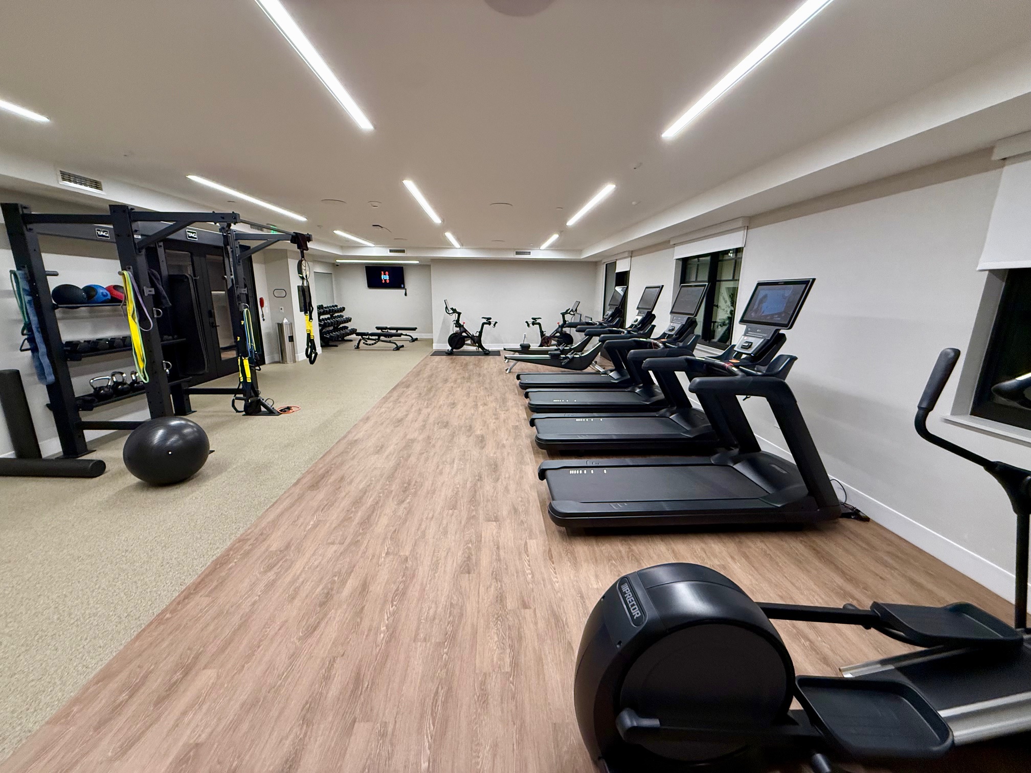 a room with treadmills and exercise equipment