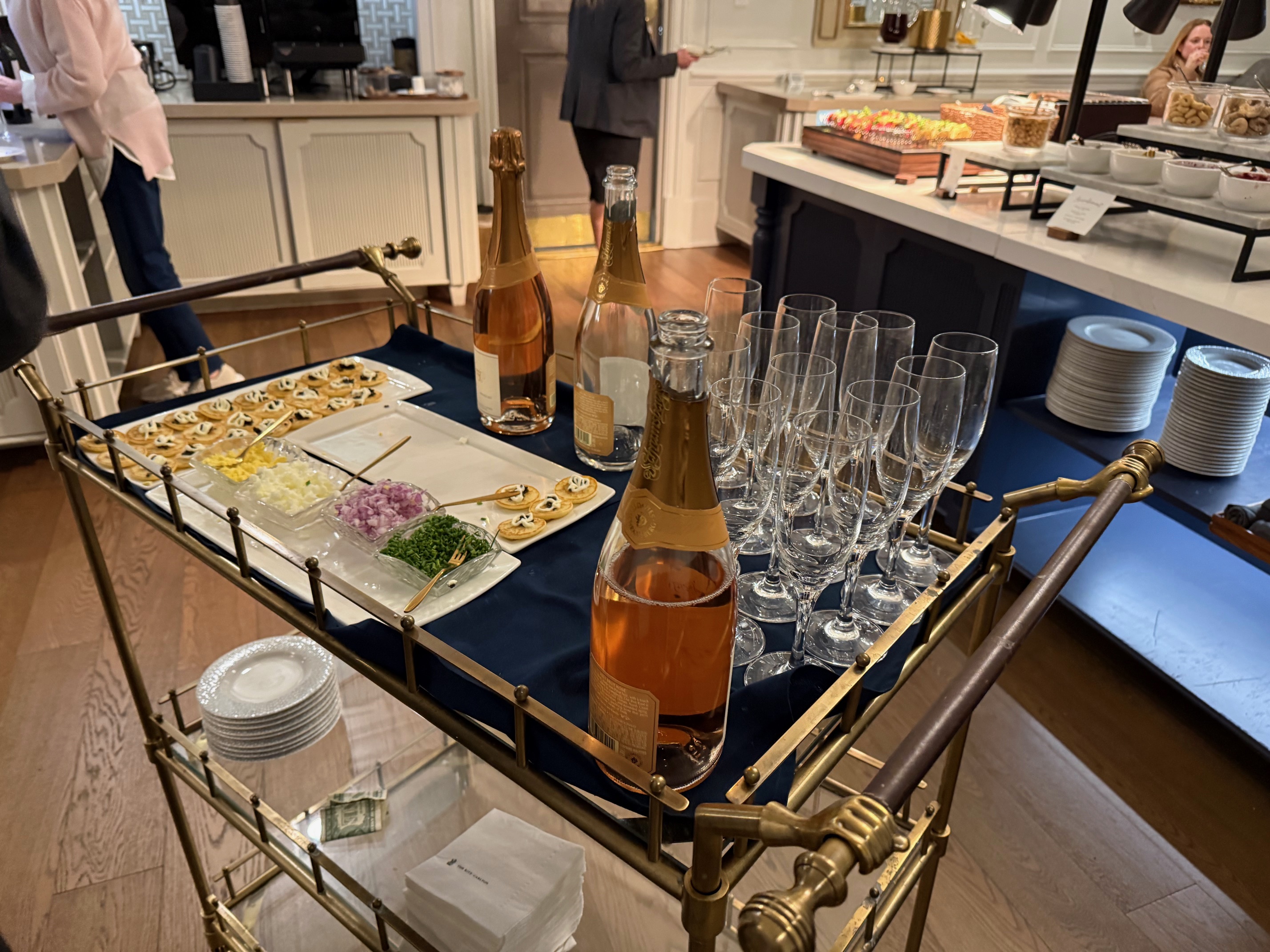 a bar cart with champagne and glasses at the Ritz Carlton New Orleans
