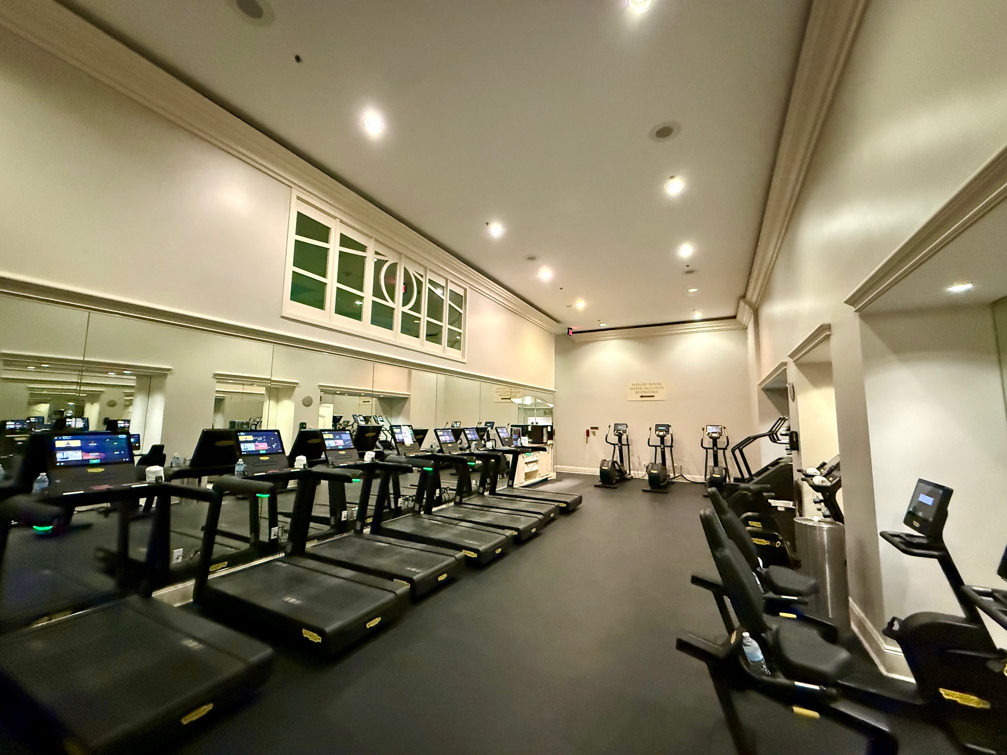 a room with treadmills and machines at the Ritz Carlton New Orleans