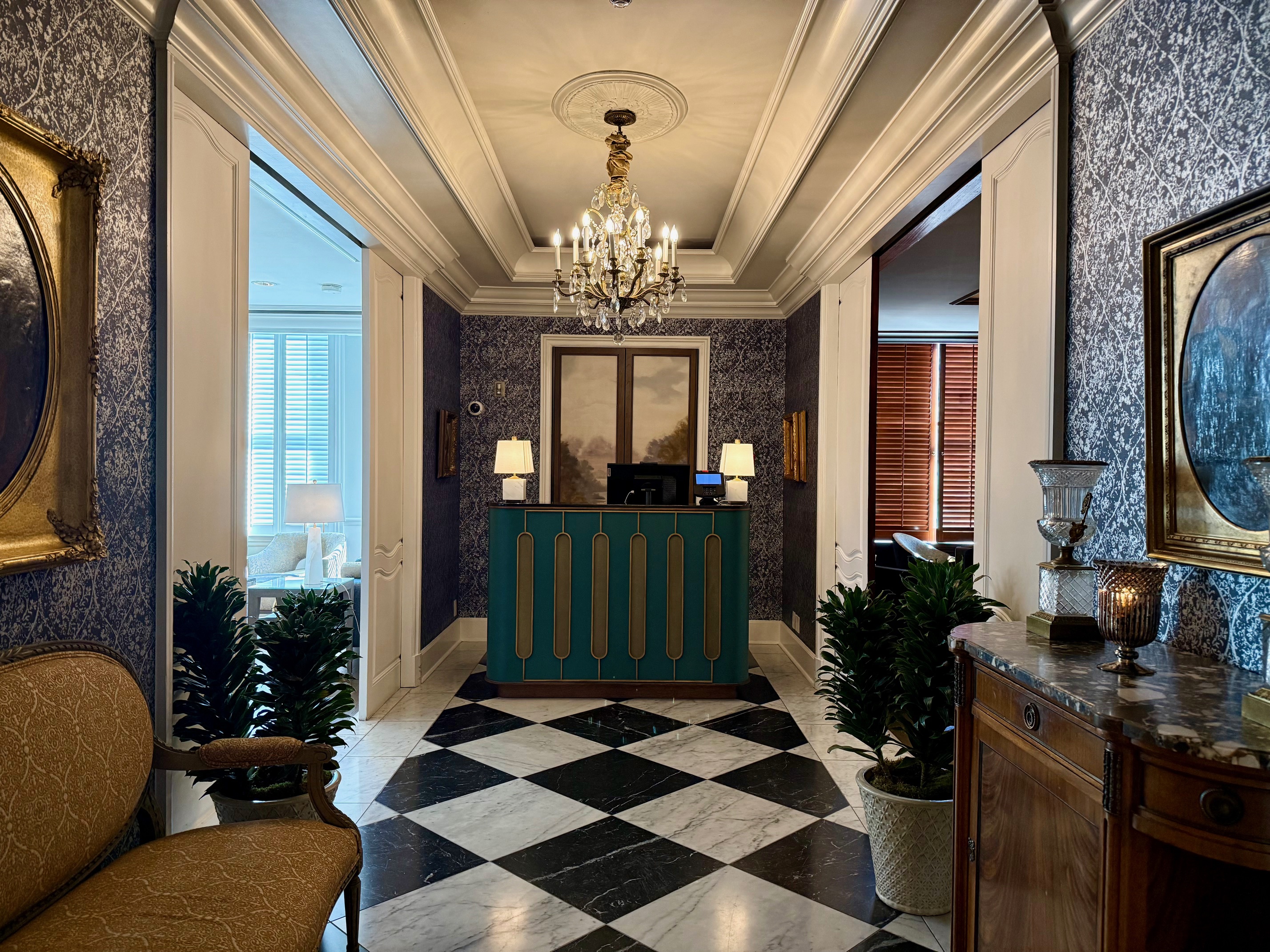 a checkered floor with a chandelier and a checkered floor at the Ritz Carlton New Orleans