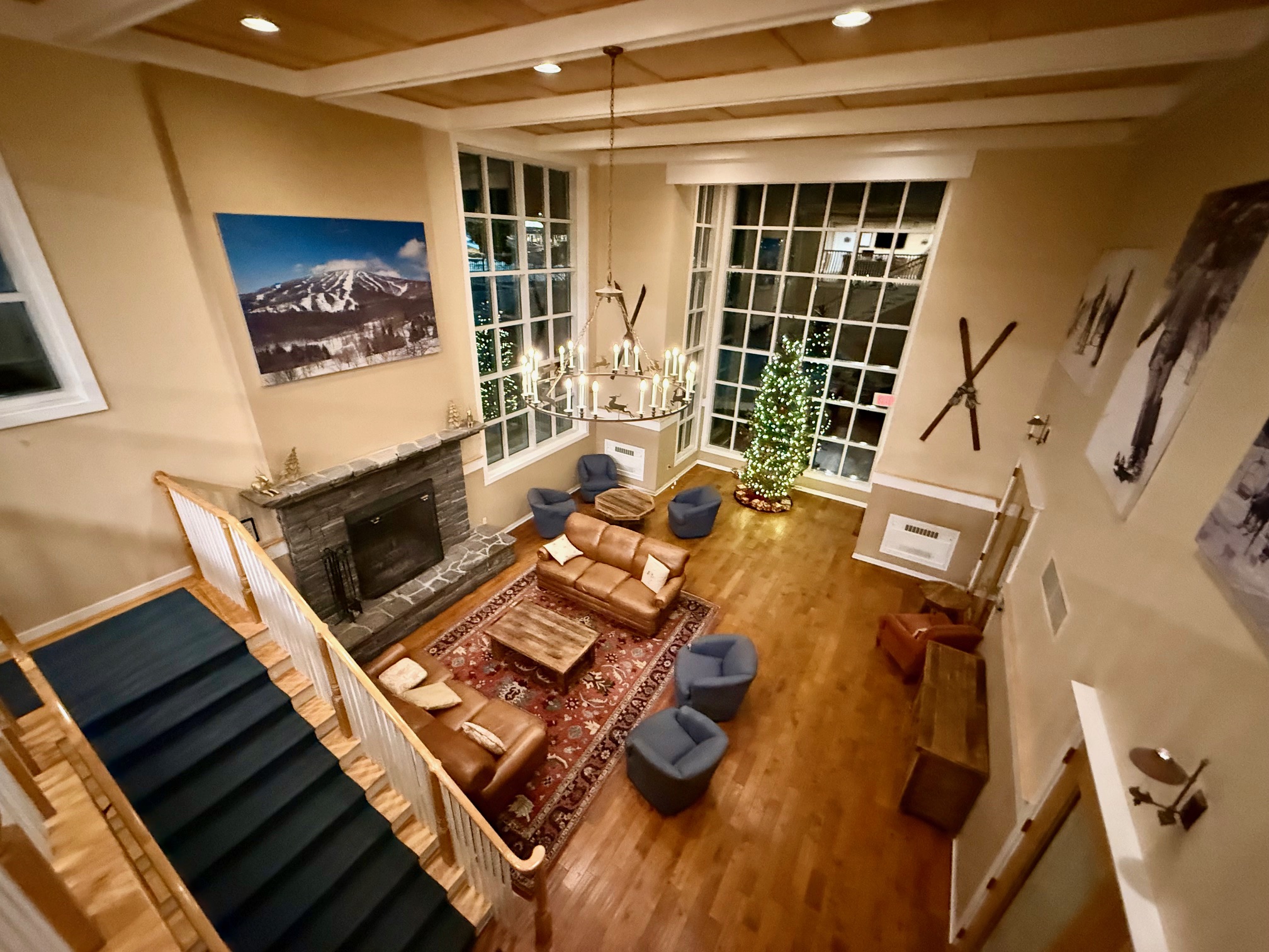 a room with a fireplace and a couch Long Trail House Stratton