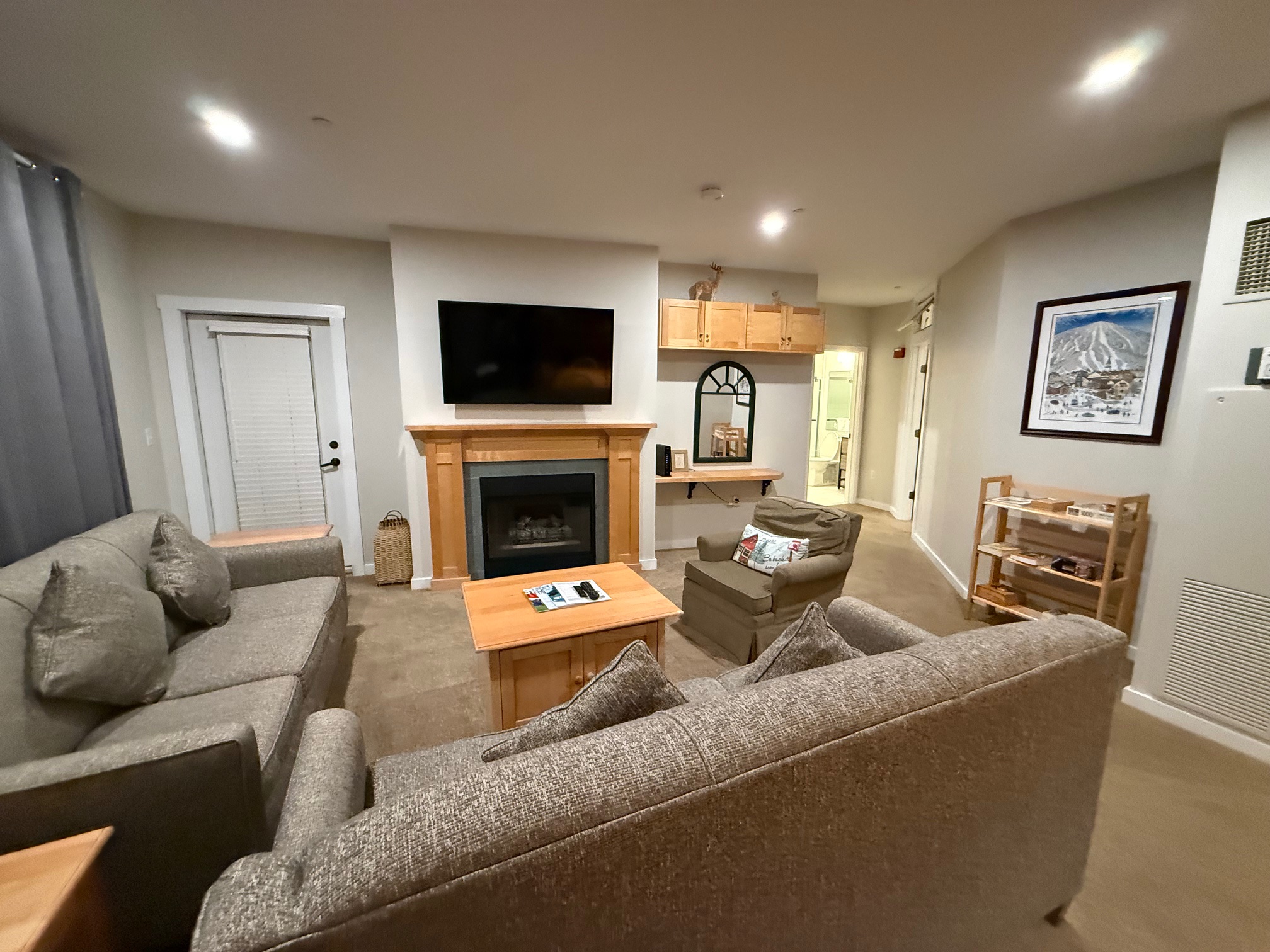 a living room with a fireplace and couches