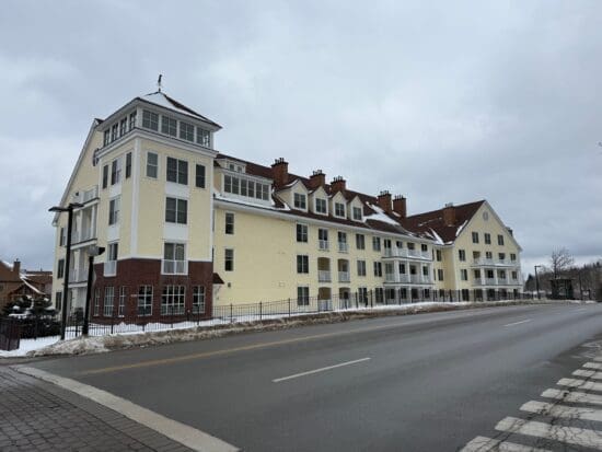 Long Trail House Stratton with a street in the background