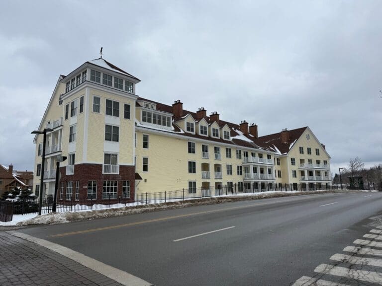 Long Trail House Stratton with a street in the background