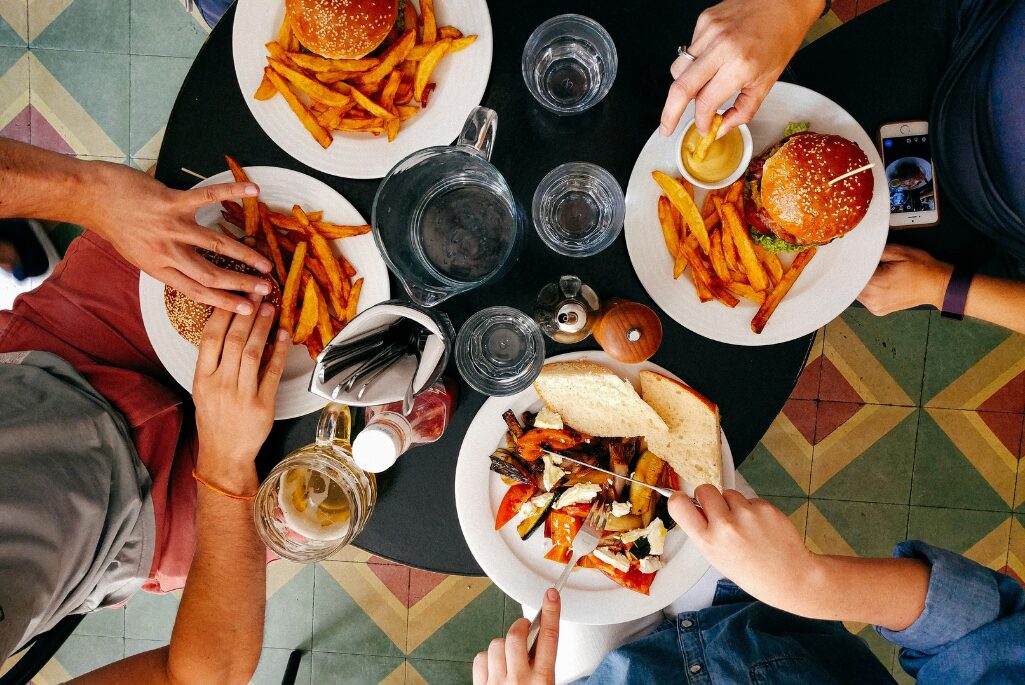 A group of people seated at a table eating food