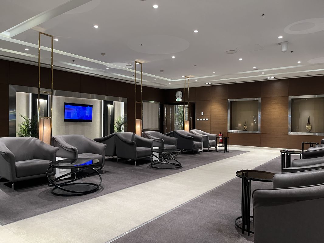 a room with chairs and a television