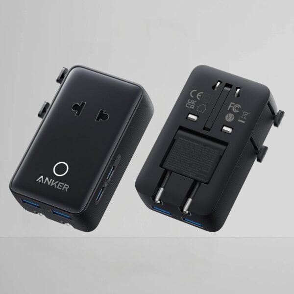 The front and back of an Anker international power outlet adapter