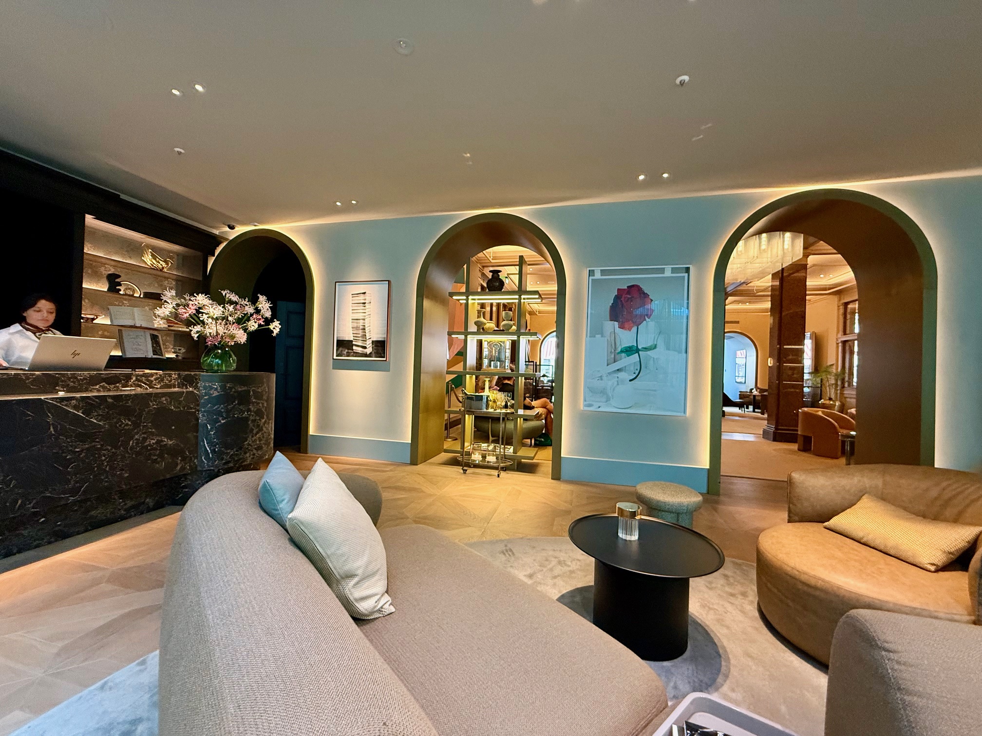 a room with a couch and a table at the Rosewood Amsterdam