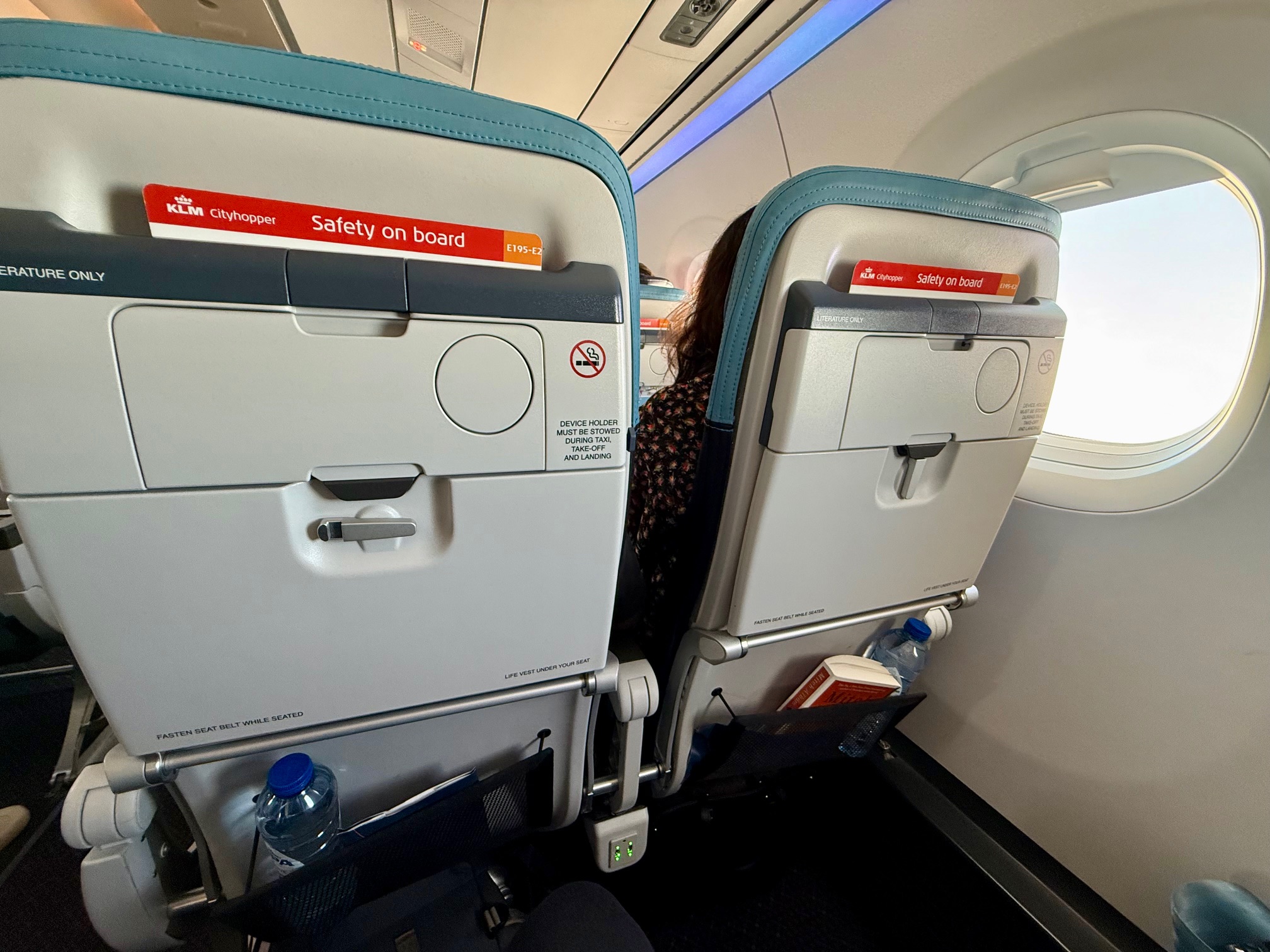 a person sitting in an airplane seat