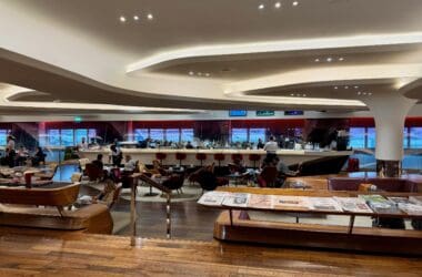 a large room with a large counter and tables at the Virgin Atlantic Clubhouse London
