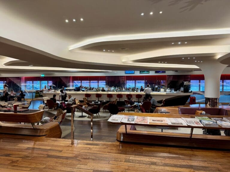 a large room with a large counter and tables at the Virgin Atlantic Clubhouse London