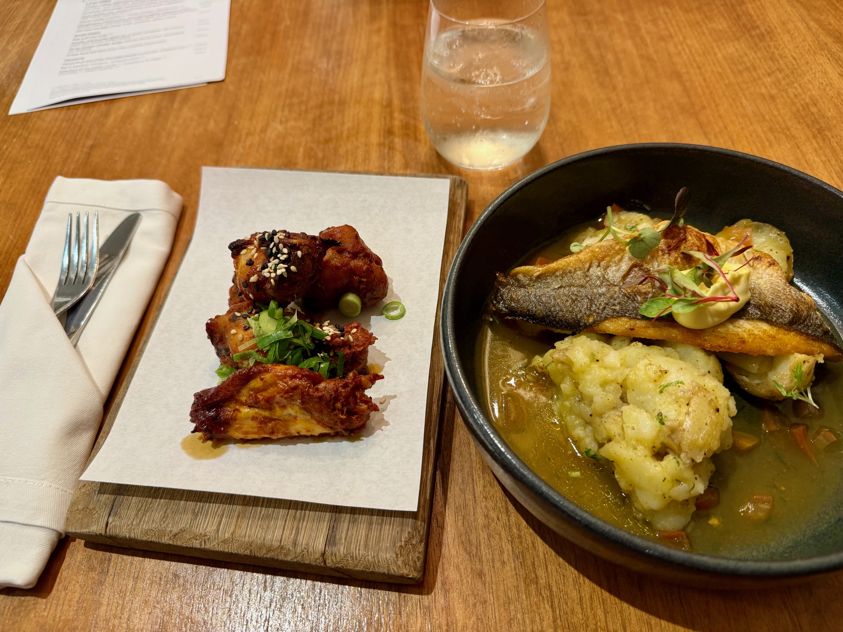 a plate of food on a table at the Virgin Atlantic Clubhouse London