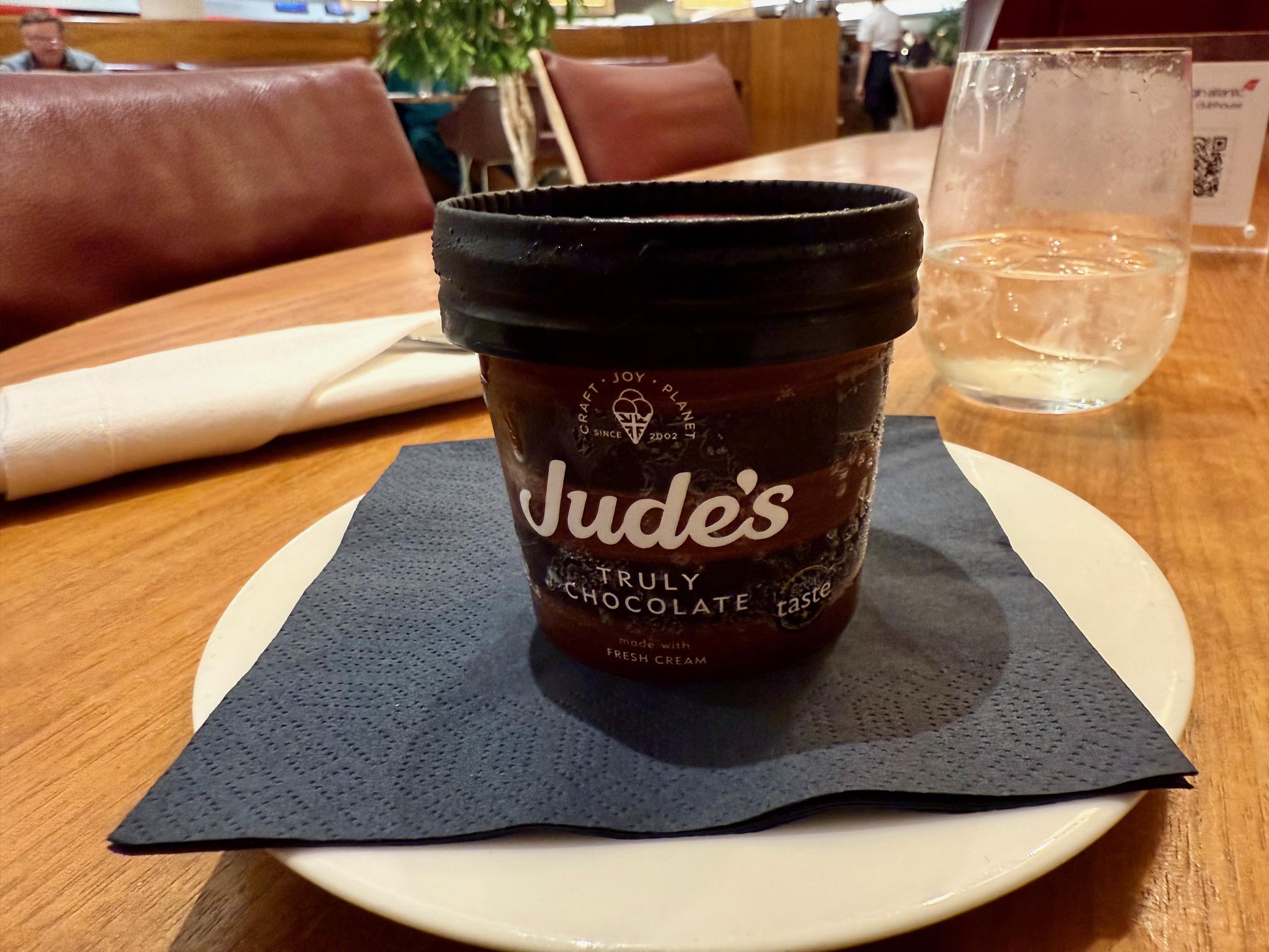 a cup of ice cream on a plate