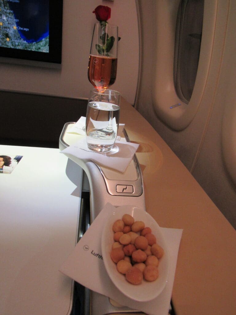 a plate of food and a glass of water on a table