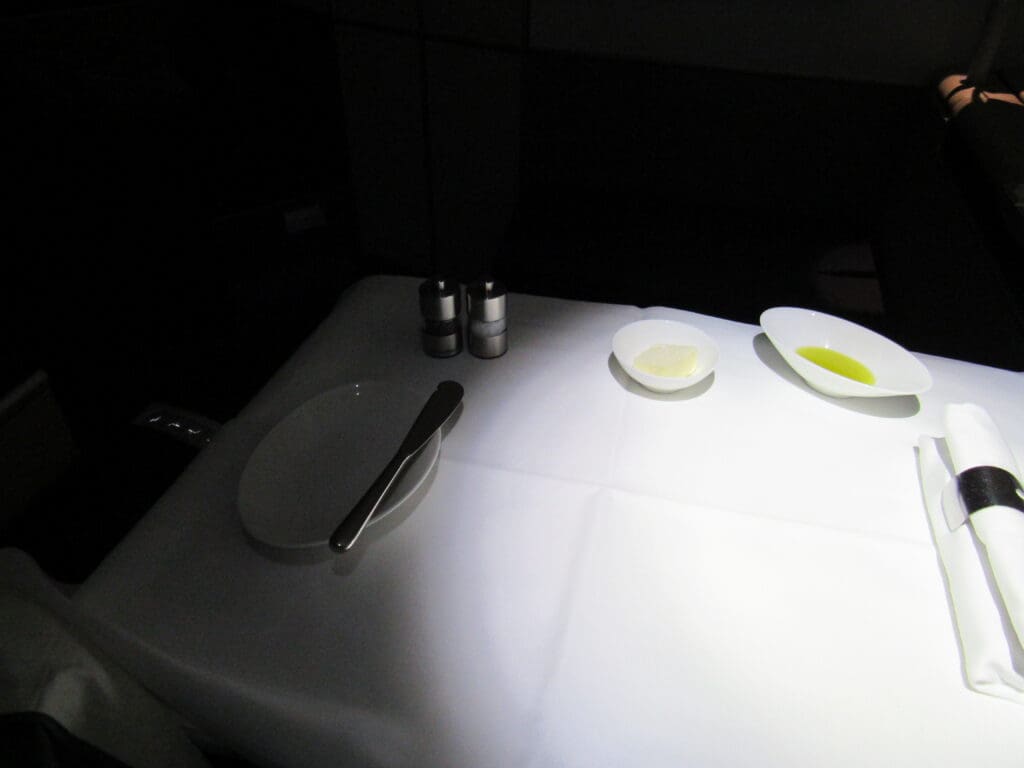 a table with a bowl and a knife on it