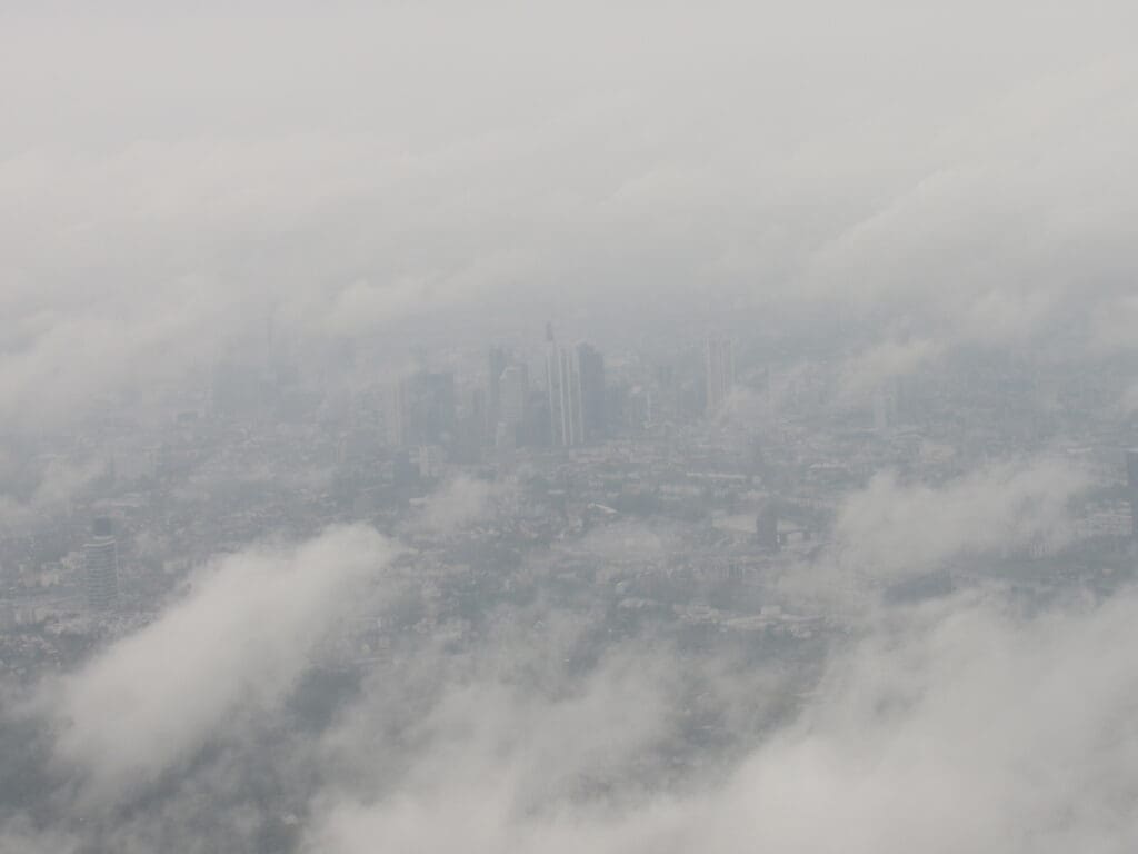 a city with clouds in the sky