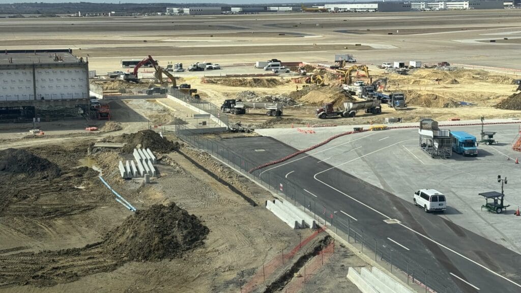 a construction site with construction equipment and dirt on the ground