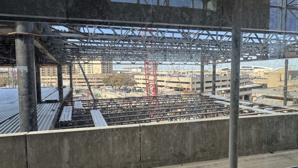 a construction site with a crane and buildings
