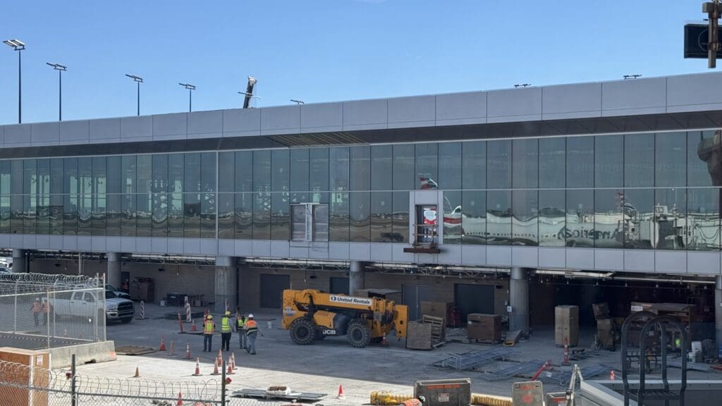 a building with a large vehicle and construction equipment