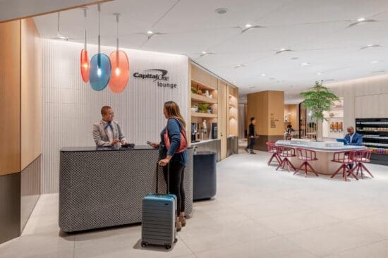 a man and woman at a reception desk
