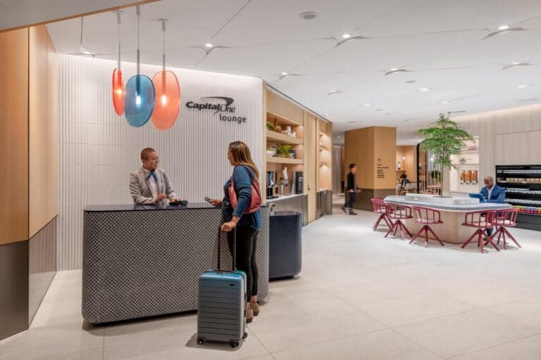 a man and woman at a reception desk