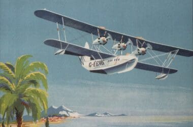 an airplane flying over a beach