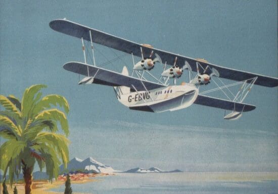 an airplane flying over a beach