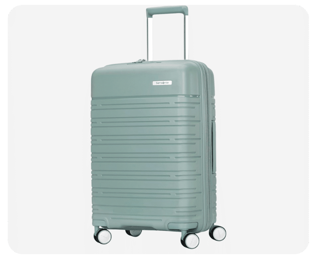 A light green Samsonite Elevation Plus carry-on bag on a neutral background