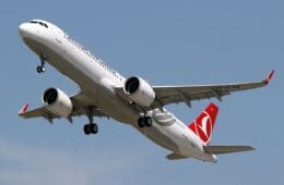 a white airplane in the sky