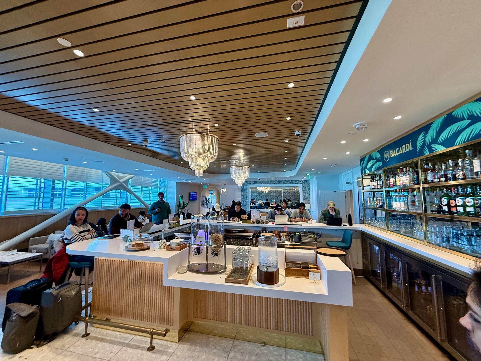 a group of people sitting at a bar