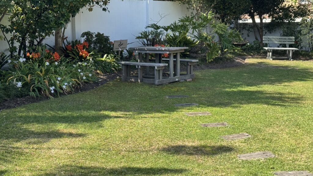 a picnic table in a garden