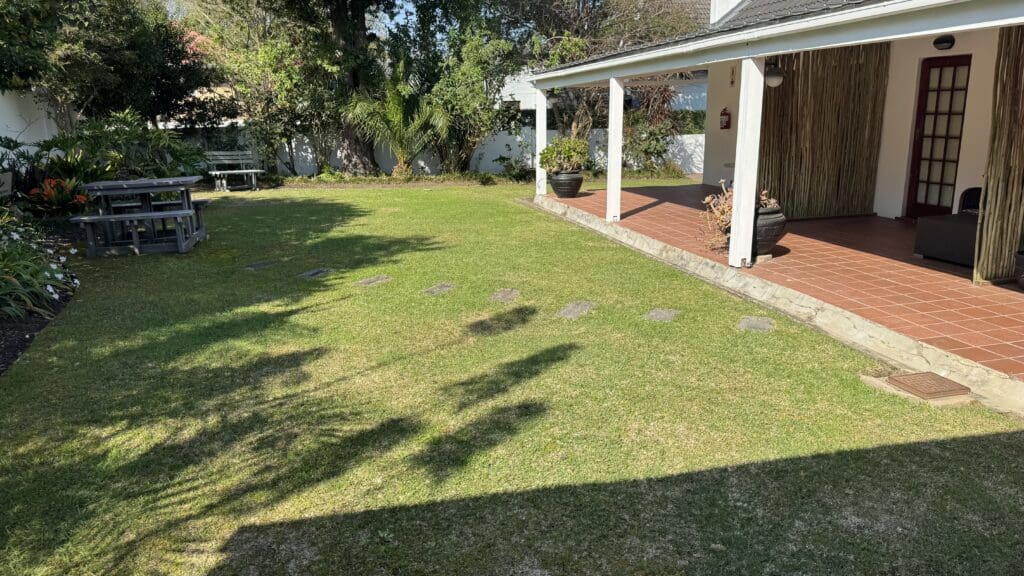 a house with a white porch and a lawn