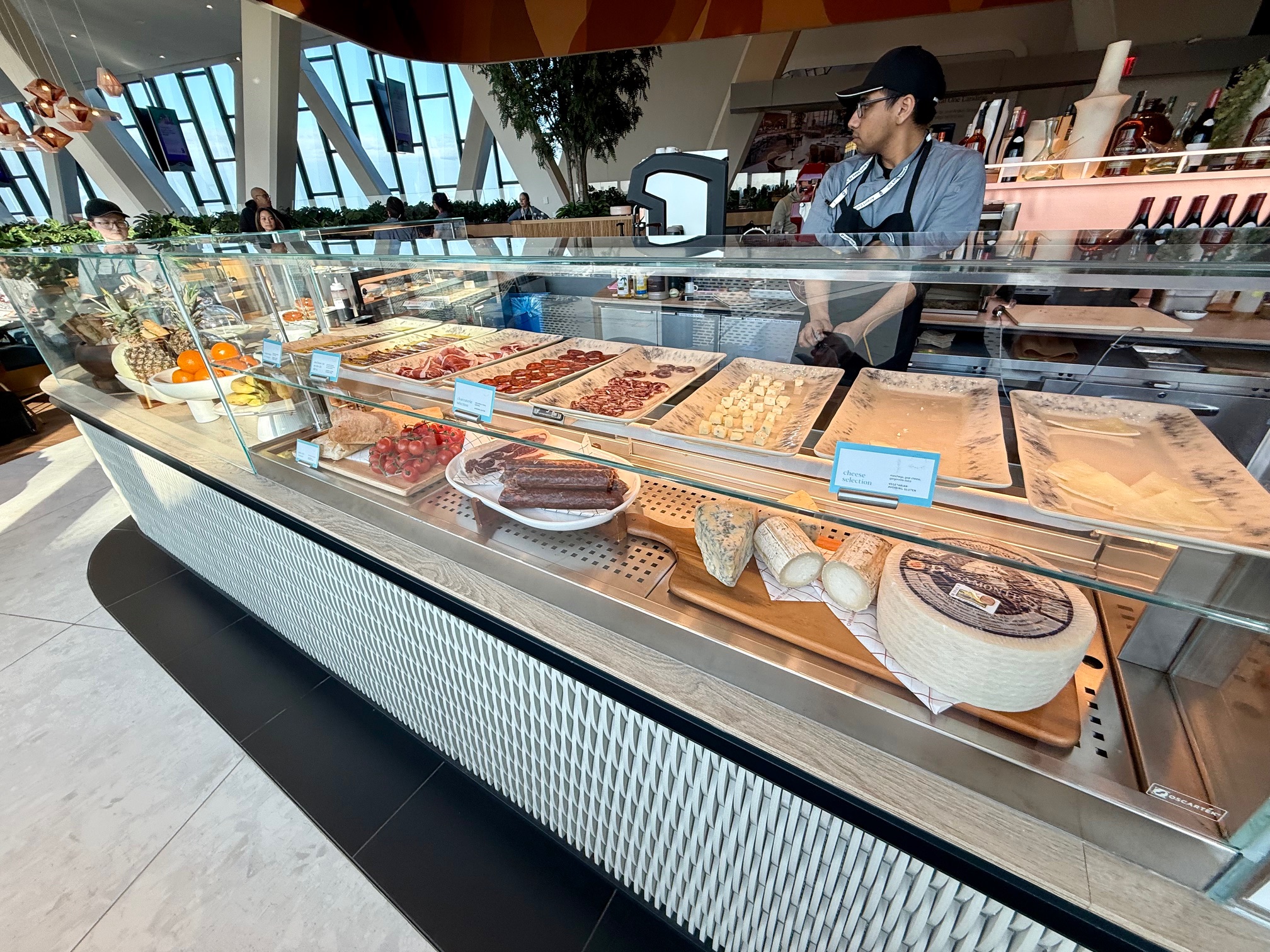 a display case with food on it at the Capital One Landing at LaGuardia