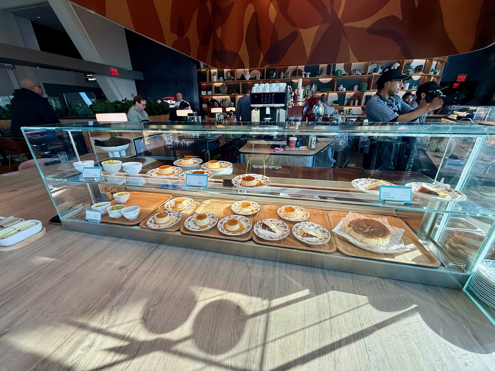 a glass case with food on it at the Capital One Landing at LaGuardia