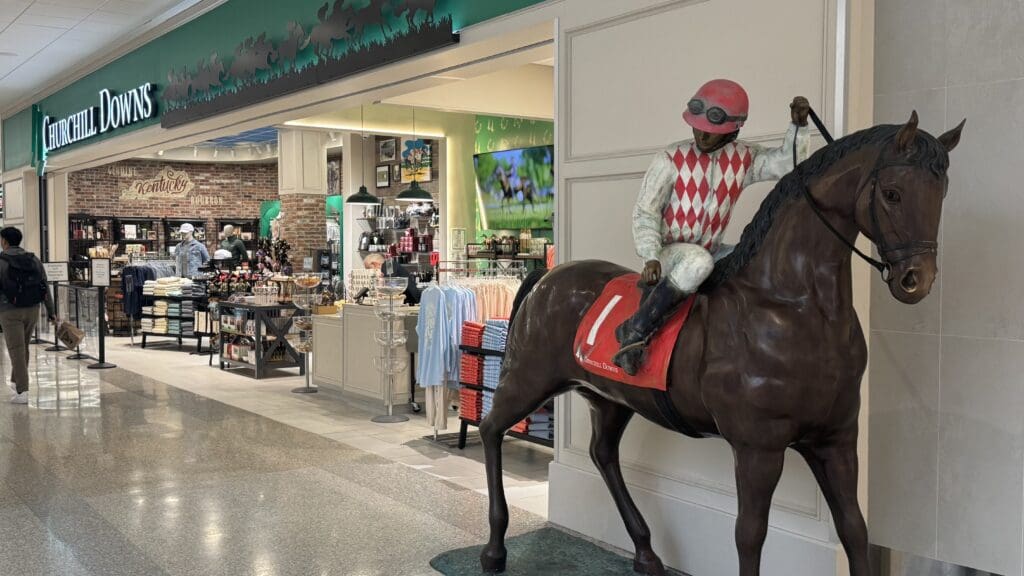 a statue of a jockey on a horse in a store
